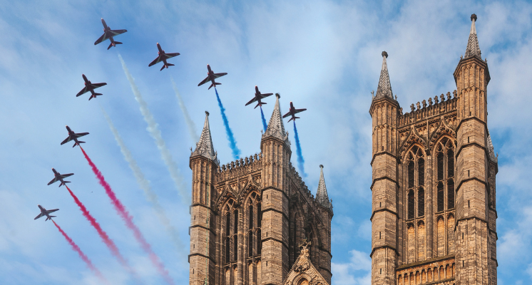 Red arrows over cathedral