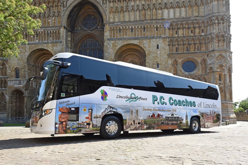 A PC Coaches bus outside Lincoln Cathedral