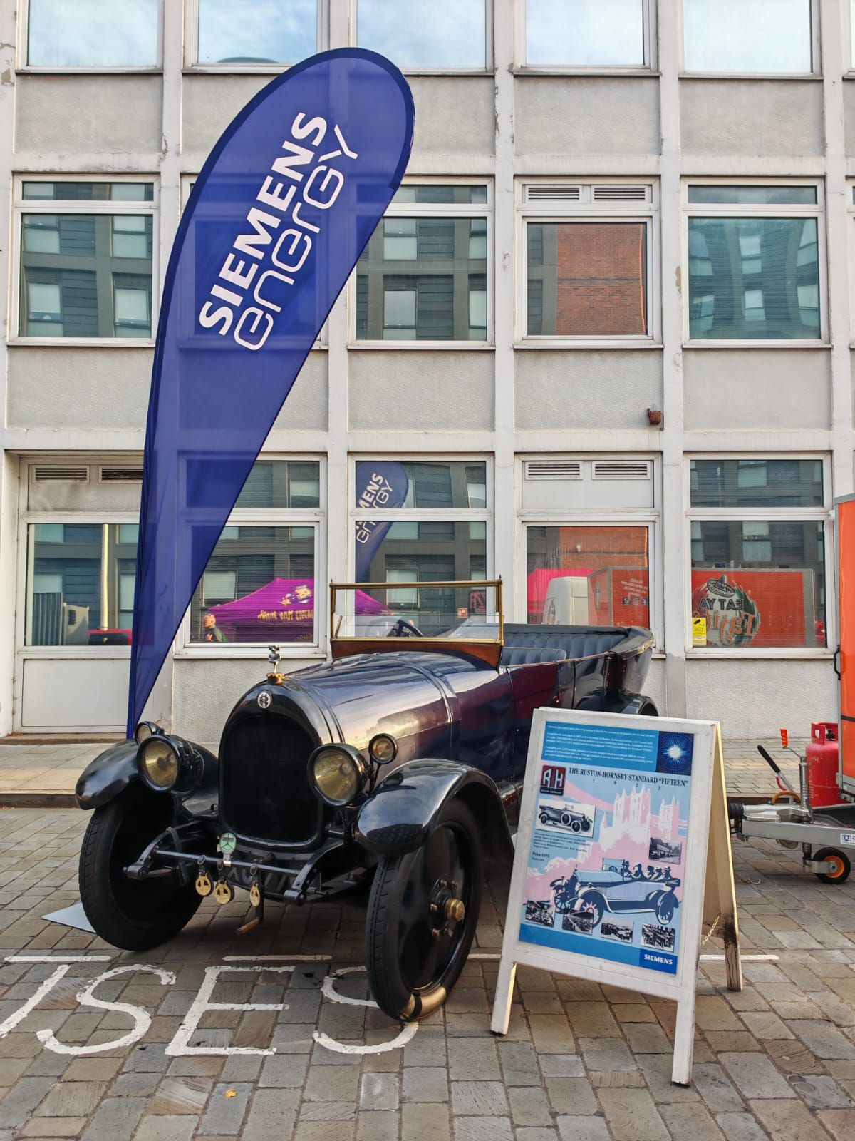 Classic car with Siemens Energy banner